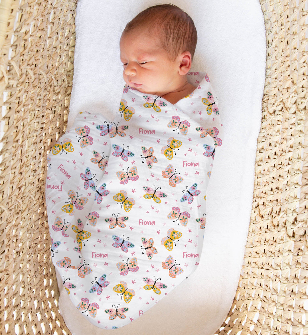 Personalised muslin swaddle wrap with baby name, soft breathable fabric, 120x120cm size, ideal for newborns and babies.
