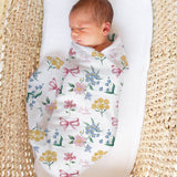 Custom muslin swaddle wrap personalised with baby’s name, soft breathable fabric, 120x120cm, gentle for newborns.