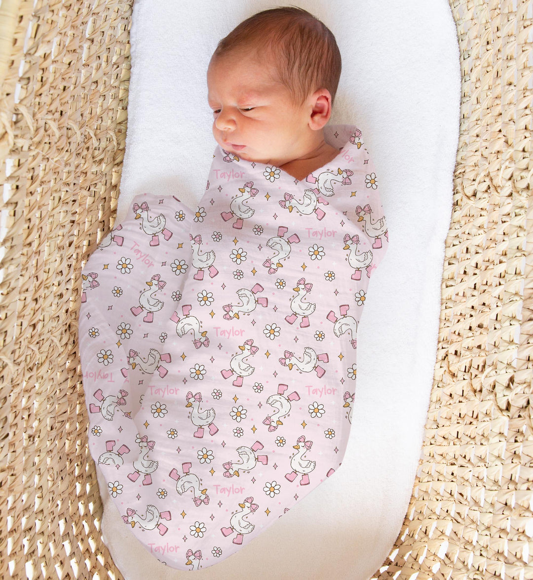 Personalised muslin swaddle wrap with baby name, soft breathable fabric, 120x120cm, ideal for newborns and gifts