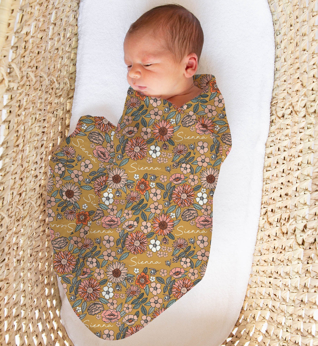 Personalised muslin swaddle wrap with baby’s name, soft breathable fabric, 120x120cm size for newborns.