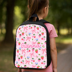 Personalised kids double pocket school backpack showing front pocket and side mesh bottle holders