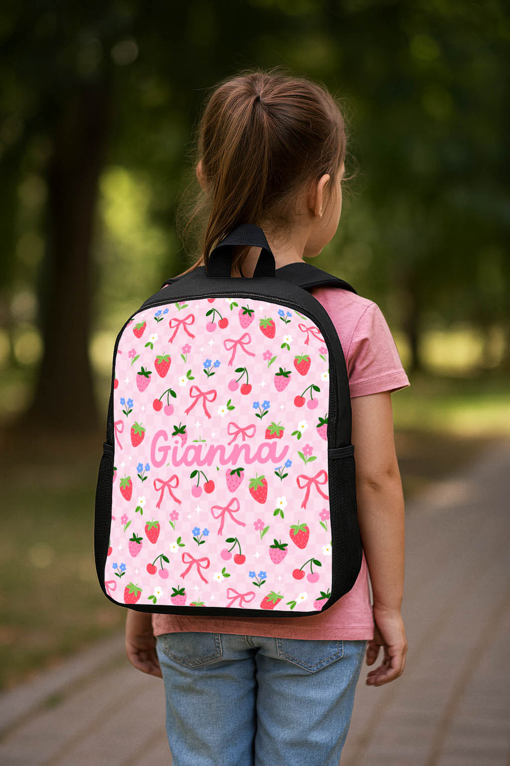 Personalised kids double pocket school backpack showing front pocket and side mesh bottle holders