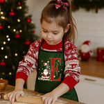 Child wearing Santa Initial Kids Apron