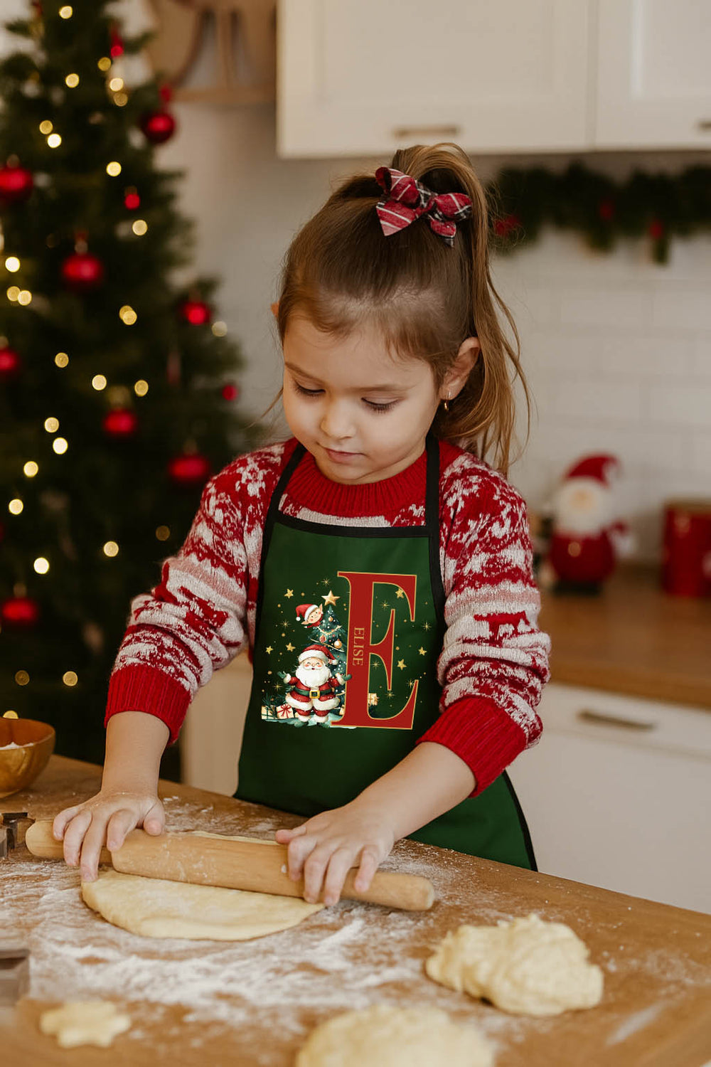 Child wearing Santa Initial Kids Apron