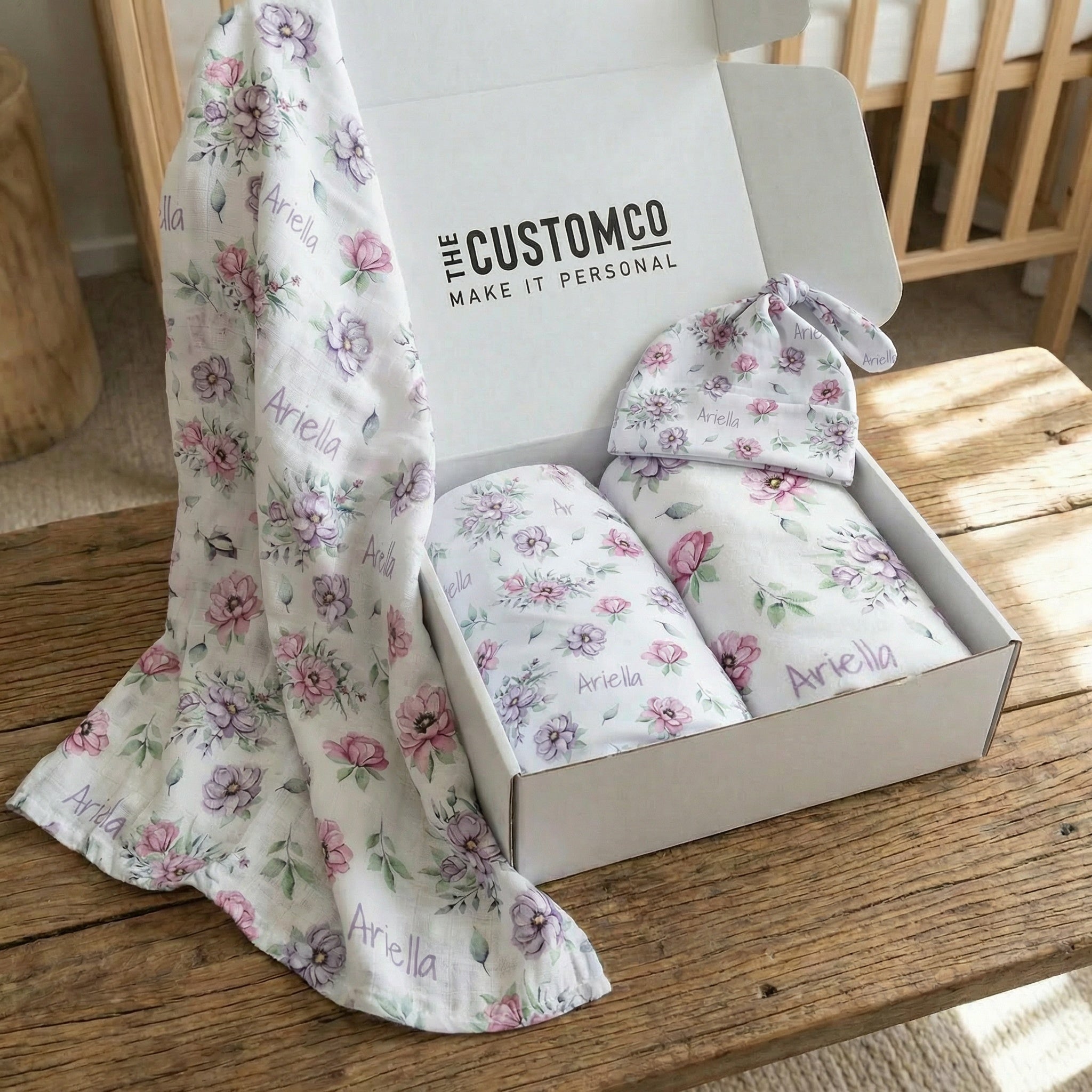 Gift bundle set with ultra-soft minky blanket, breathable muslin swaddle, and stretchy jersey swaddle with matching beanie