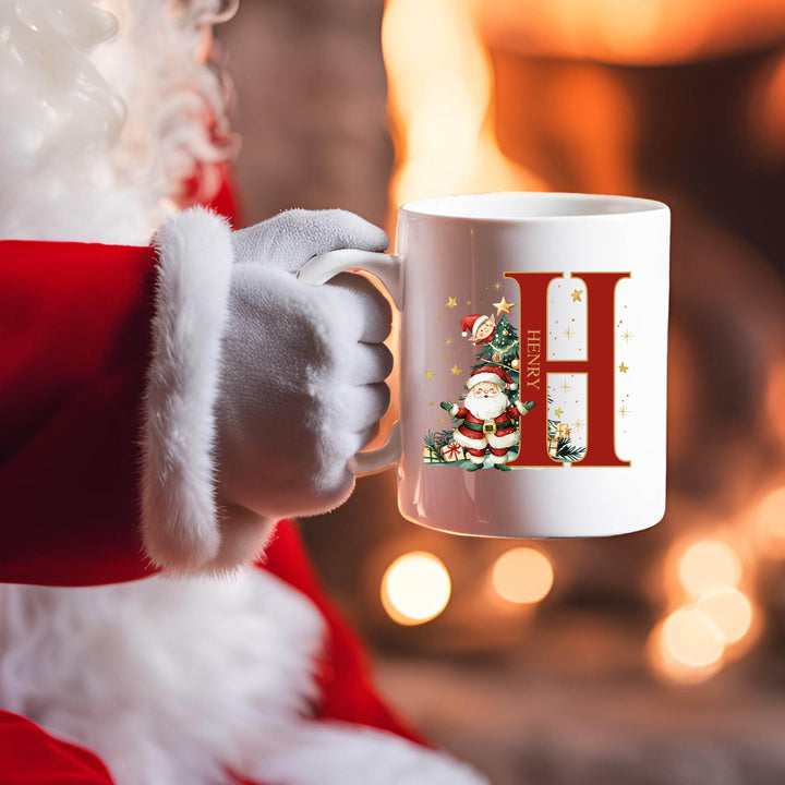 Santa Claus holding personalised Christmas ceramic mug