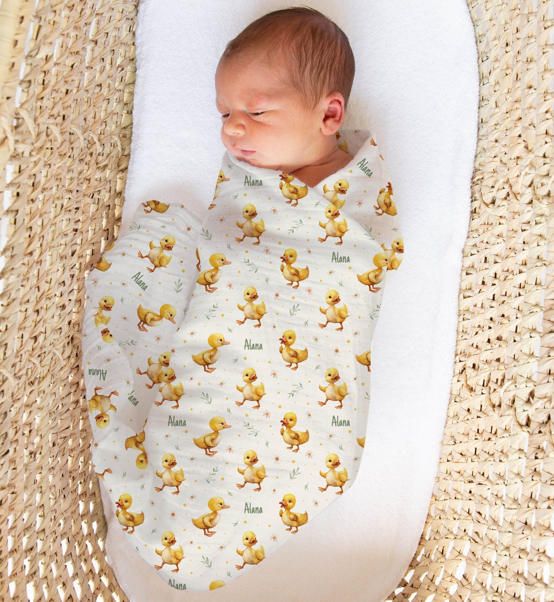 Personalised muslin swaddle wrap with baby name, soft breathable fabric, 120x120cm, ideal for newborn comfort and gifts