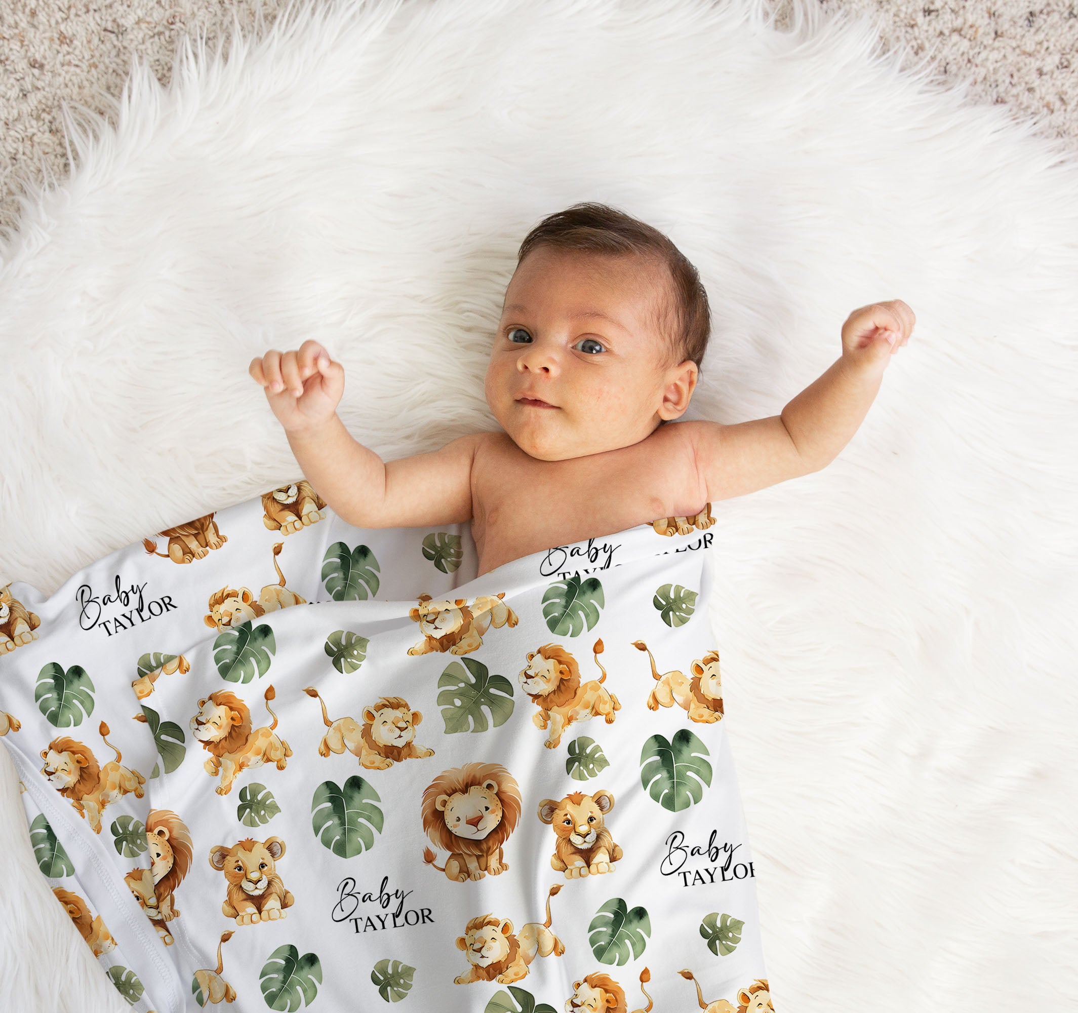 Newborn baby wrapped in personalised swaddle blanket and matching custom beanie for newborn photo shoot