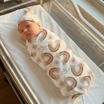 Custom baby swaddle wrap and beanie set made from soft stretch poly fabric with personalized design and name