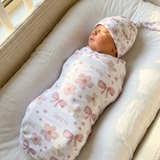 Personalised swaddle blanket and beanie set made from stretch poly fabric for newborn comfort and style