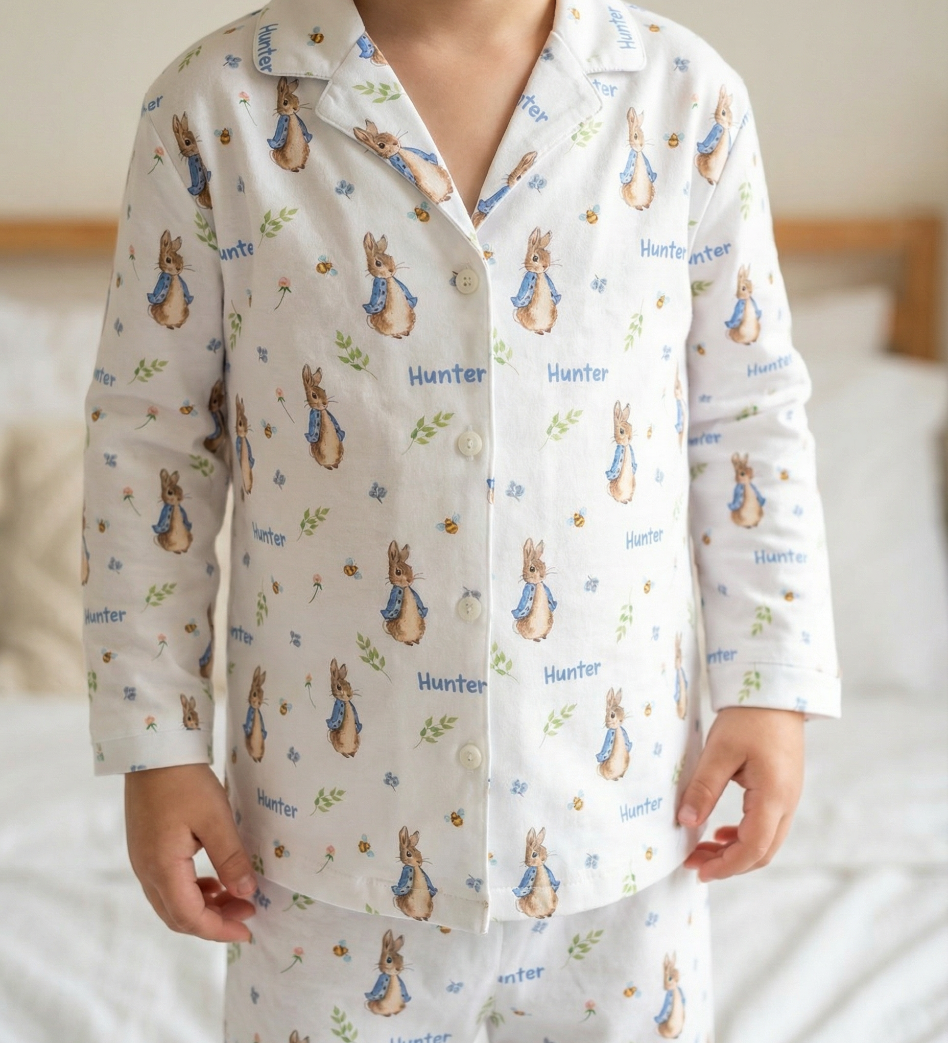 Personalised long sleeve kids Easter pyjamas with all-over festive print and child’s name