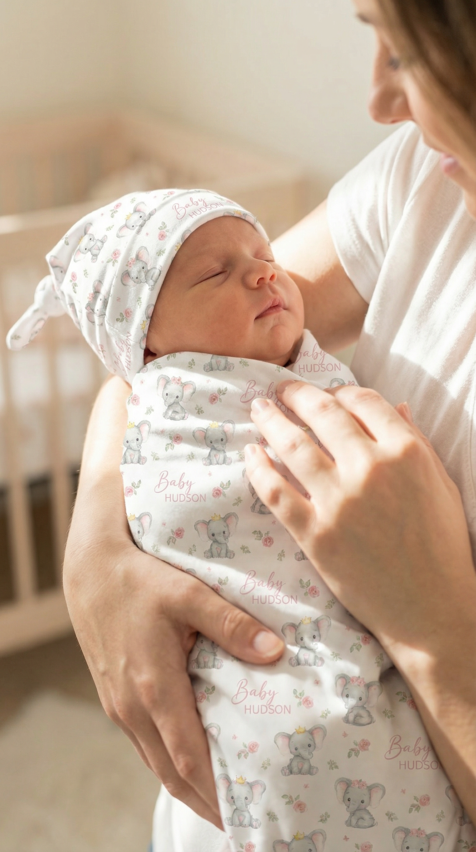 Custom swaddle wrap and beanie set made from soft premium stretch poly fabric with personalized design for newborns.