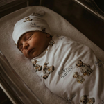 Personalised custom swaddle wrap and beanie set for newborns by The Custom Co.
