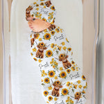 Personalised baby swaddle and beanie set with custom name design by The Custom Co.