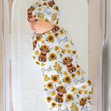 Personalised baby swaddle and beanie set with custom name design by The Custom Co.