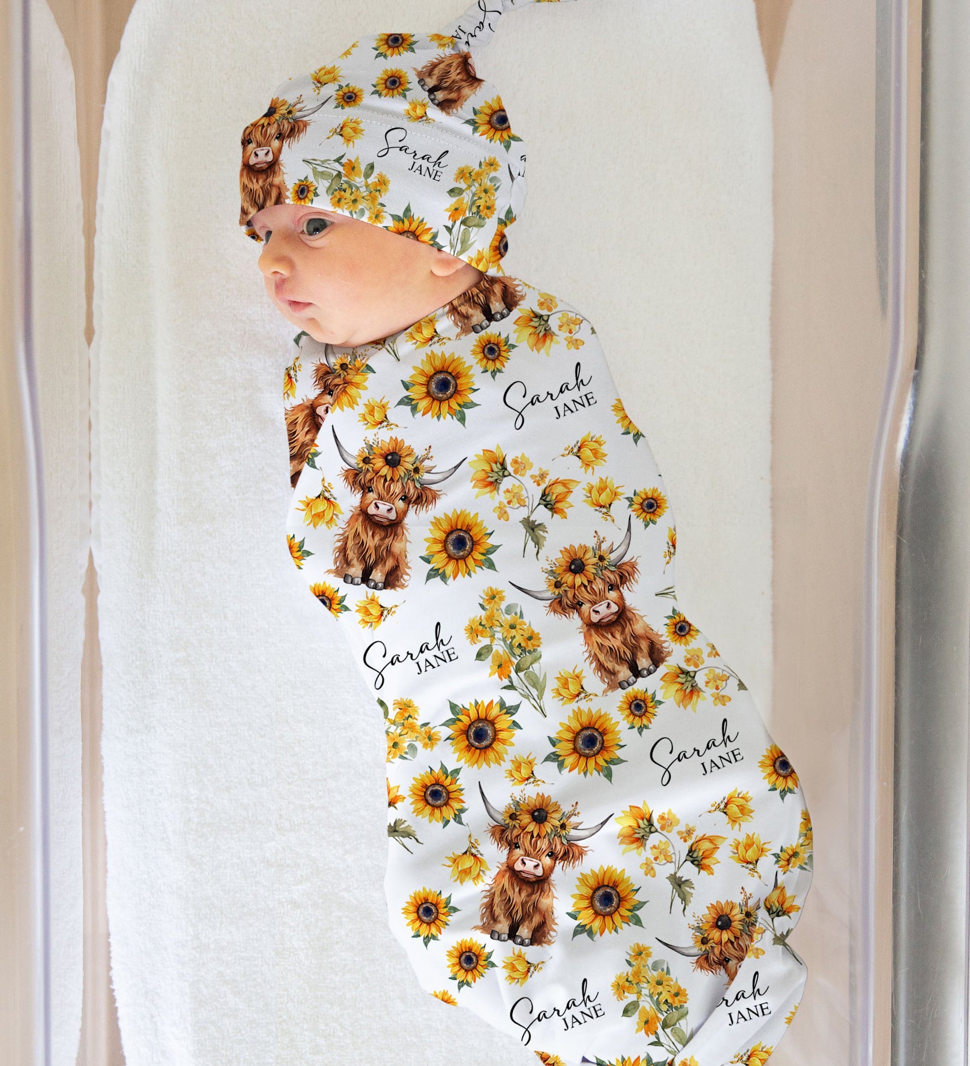 Personalised baby swaddle and beanie set with custom name design by The Custom Co.