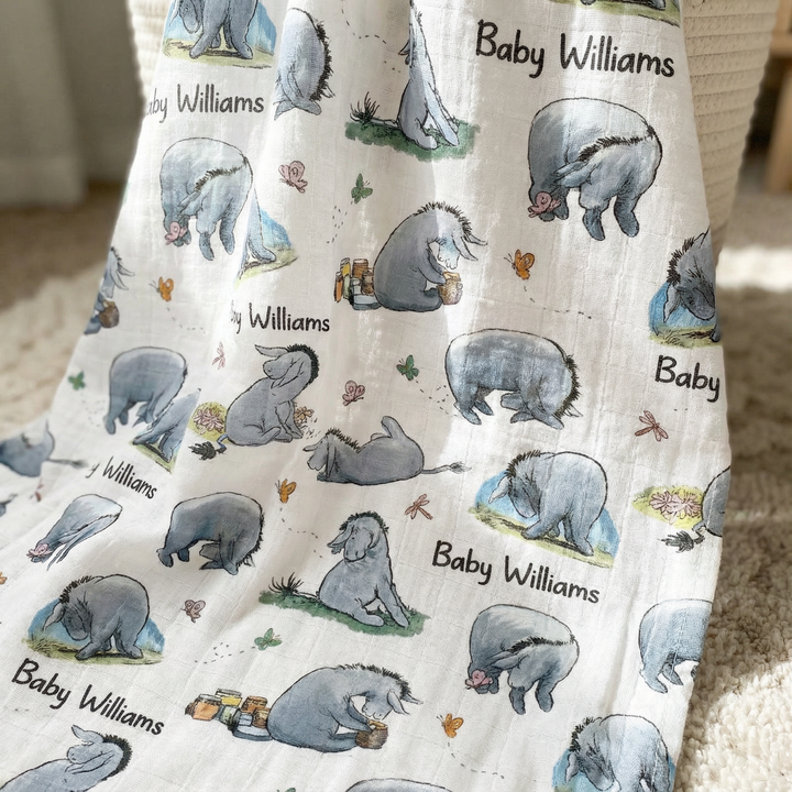 Personalised muslin swaddle wrap with baby name, soft breathable fabric, 120x120cm size, perfect for newborns and infants.