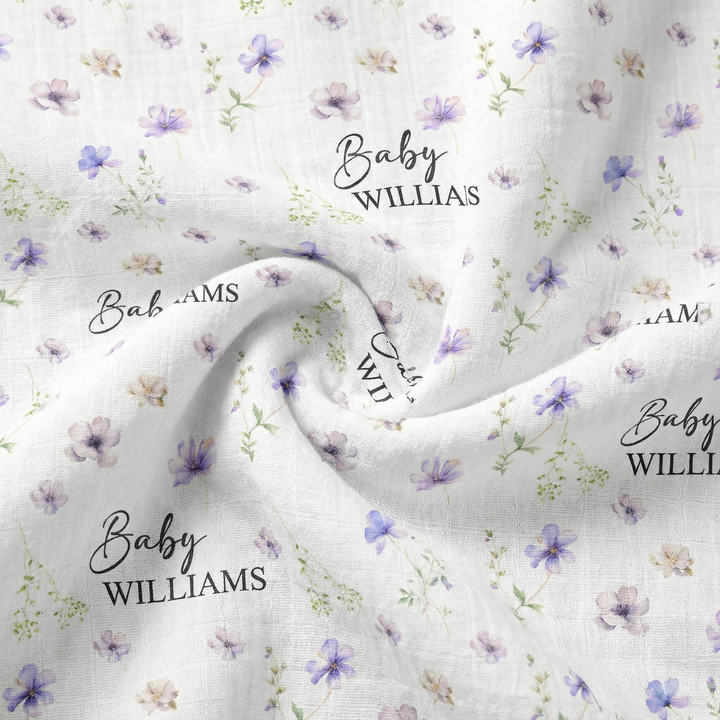 Custom muslin swaddle wrap personalized with baby’s name, soft breathable fabric, 120x120cm size for newborns.