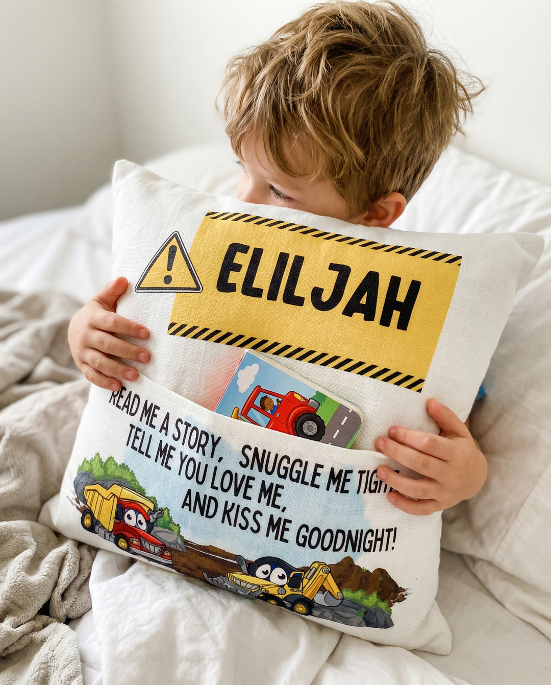 Personalised construction pocket book cushion with truck and excavator designs and child&