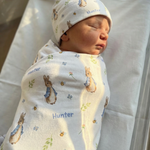 Personalised swaddle and beanie set made from soft stretch poly fabric for newborn comfort and style