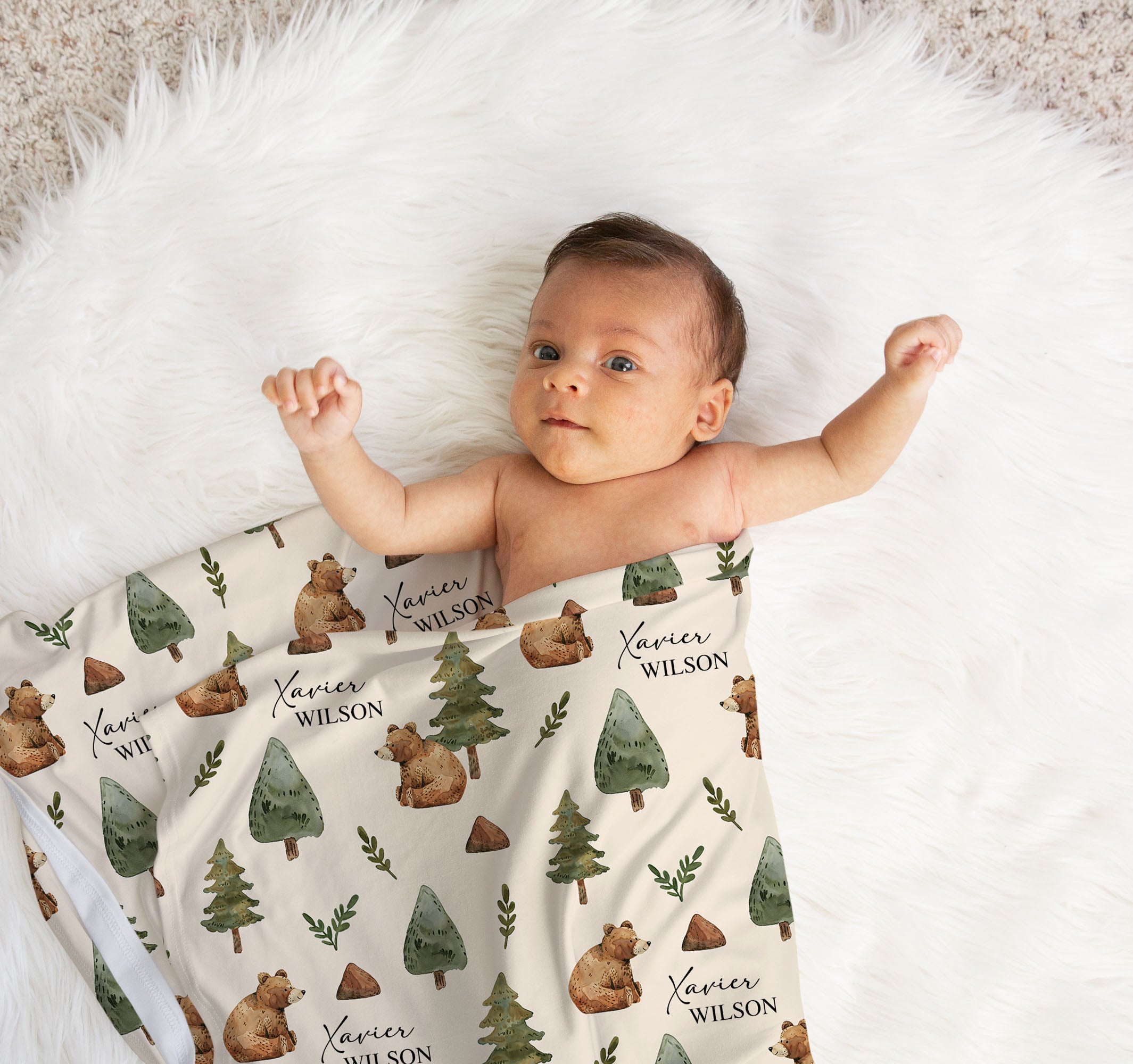 Personalised baby swaddle wrap used as a blanket in a bassinet or cot