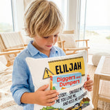 Personalised construction pocket book cushion with trucks and excavators for boys, featuring a built-in book pocket and custom name.