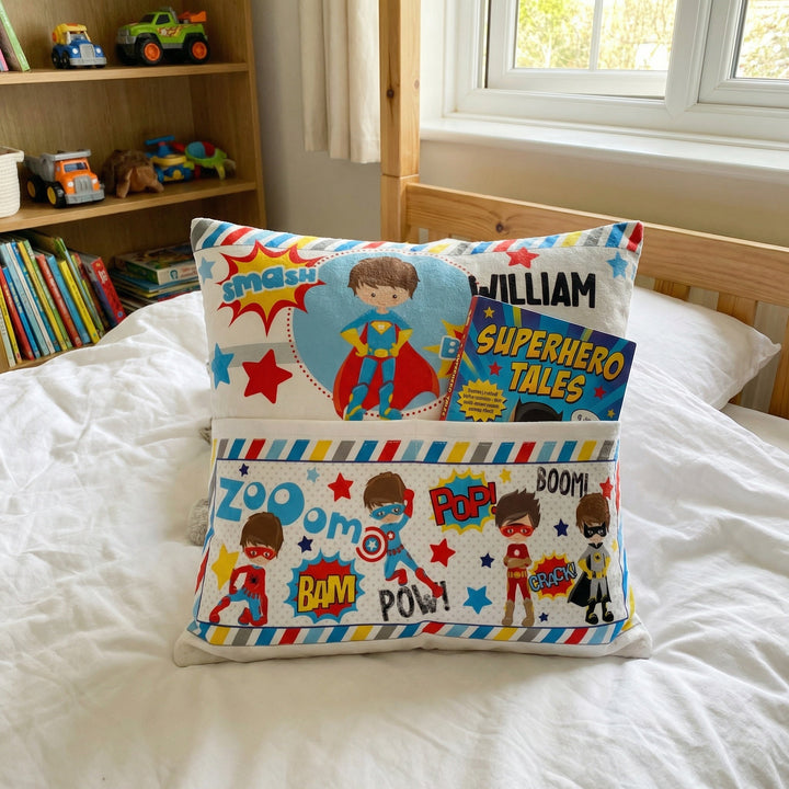 Personalised superhero pocket book cushion with built-in book pocket and custom name design