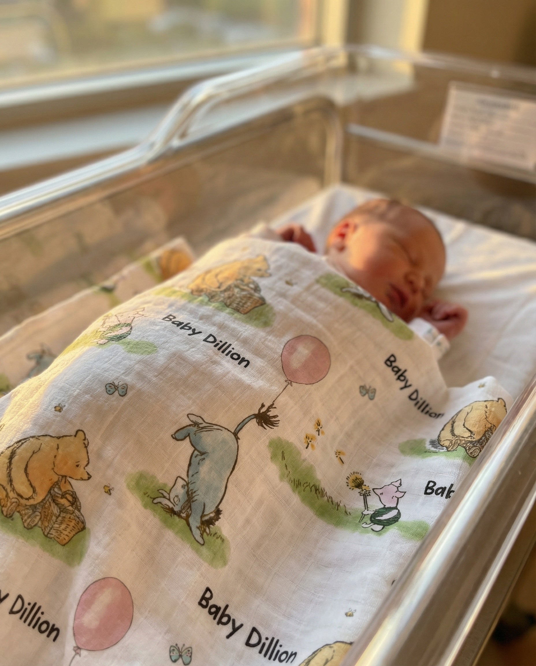 Personalised muslin swaddle wrap with baby's name, soft breathable fabric, 120x120cm size for newborns.