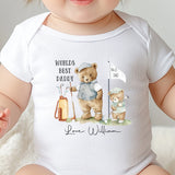 Baby wearing a soft cotton ‘World’s Best Daddy’ onesie with cute golfing design for first Father’s Day gift